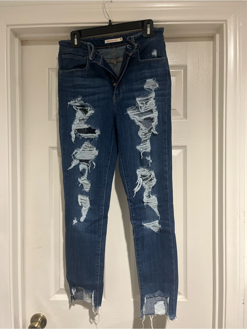 Levi's Dark Blue Distressed Skinny Jeans with Rips